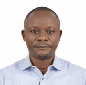 Image of a formally-dressed African male who is a TB civil society actor in DRC